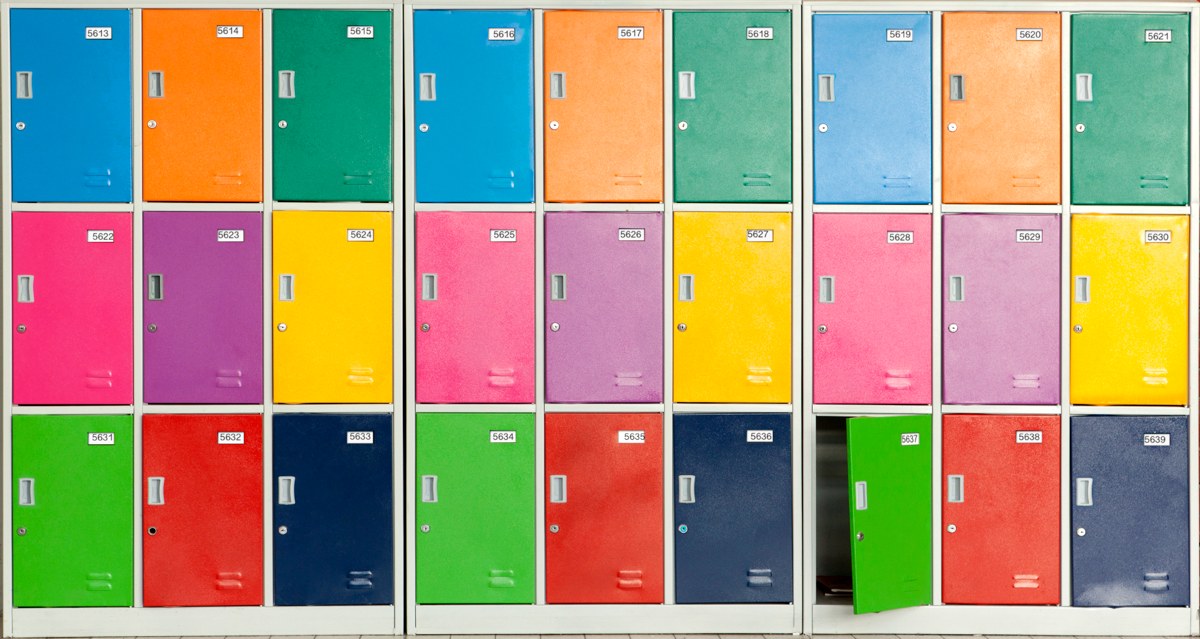 a wall of school lockers, each with a different, bright color on the door