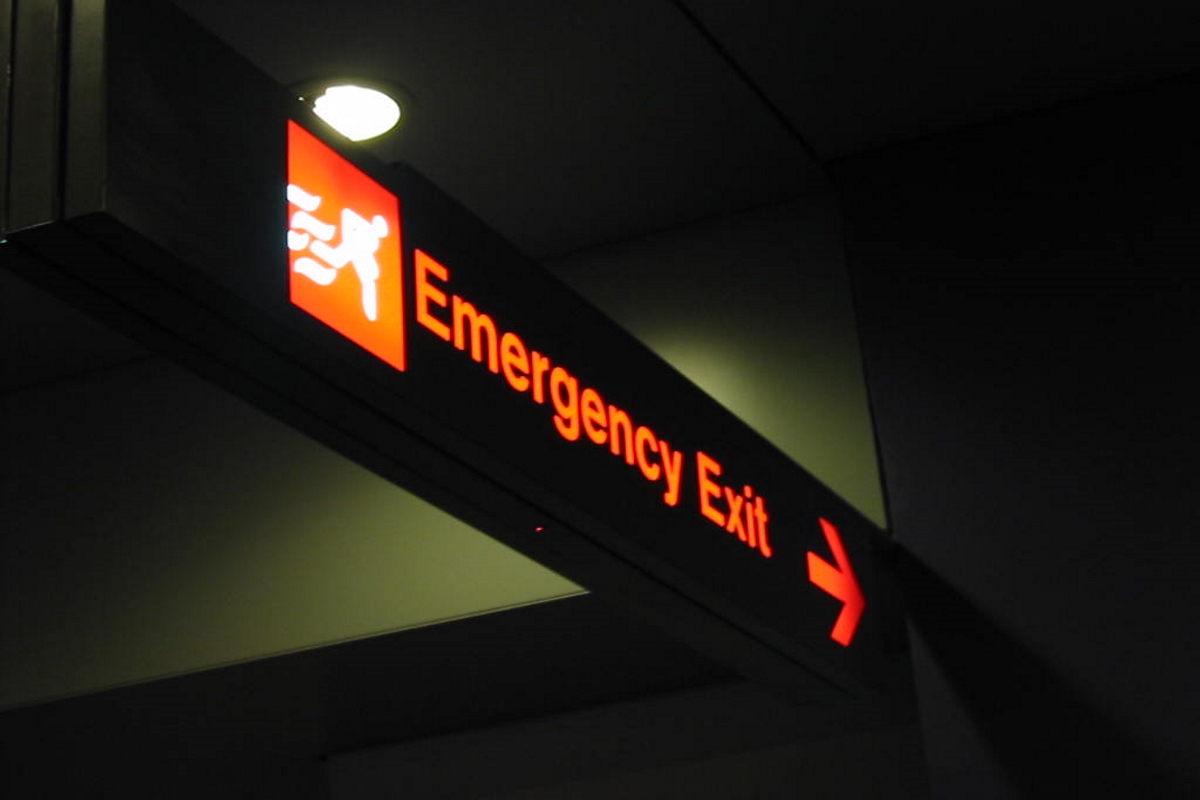 (Image)A bright glowing sign reading Emergency Exit.