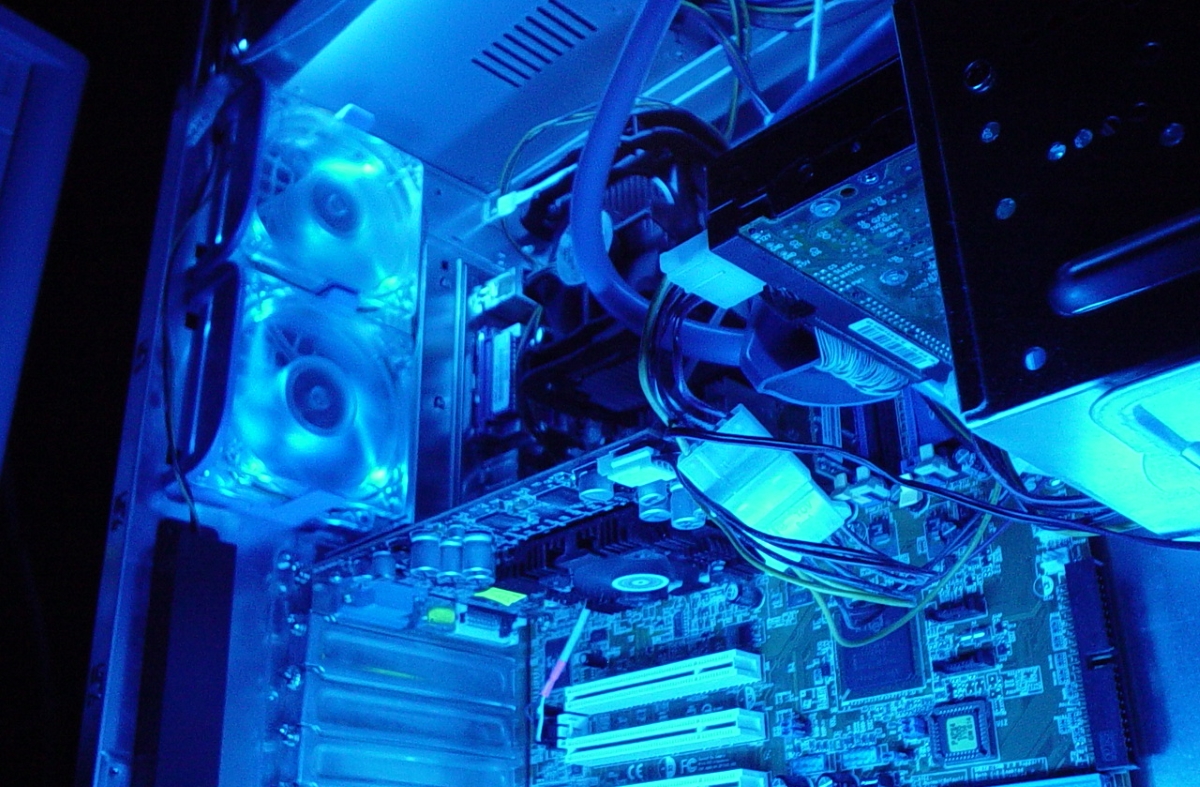 (Image) A gaming motherboard lit up in blue light.