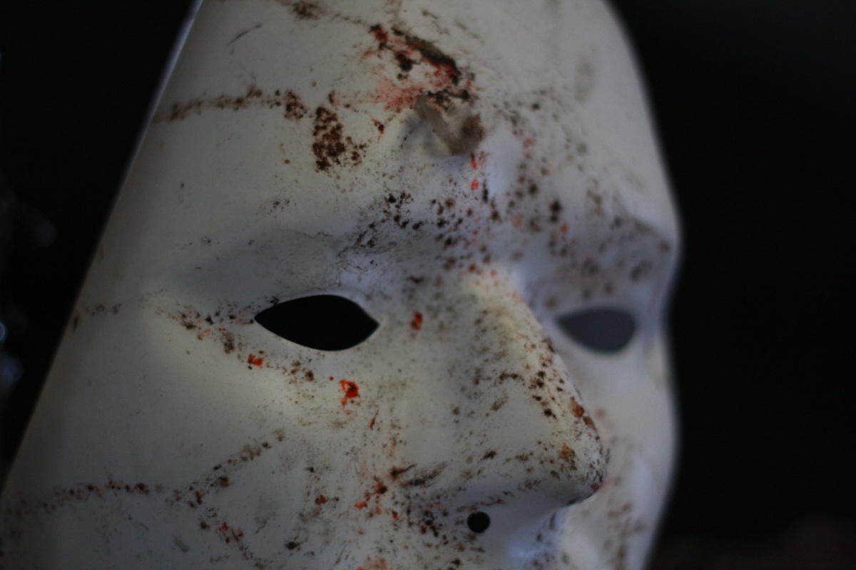 Image: Close up of a dirty white theatre mask.