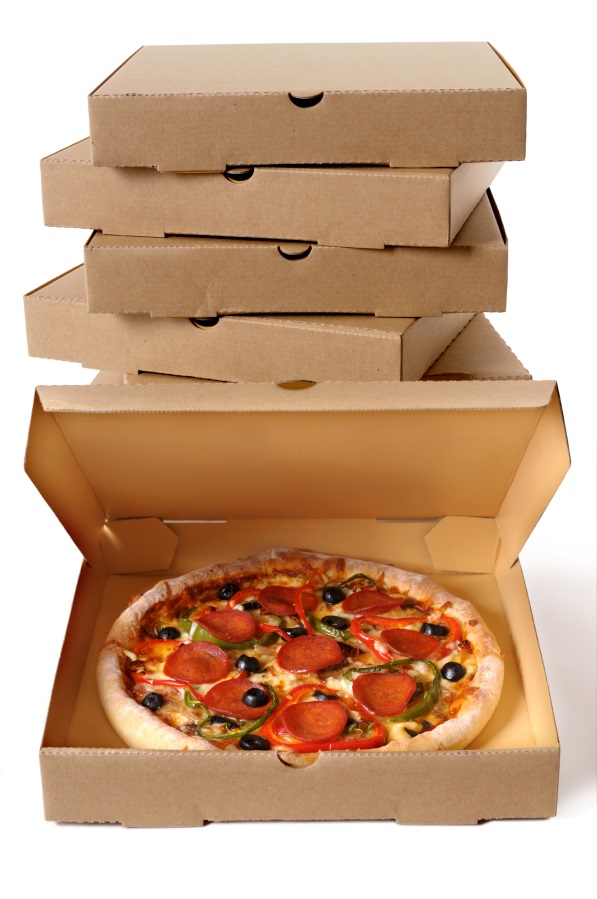 An open pizza box displaying a pepperoni supreme, with a stack of pizza boxes in the background.