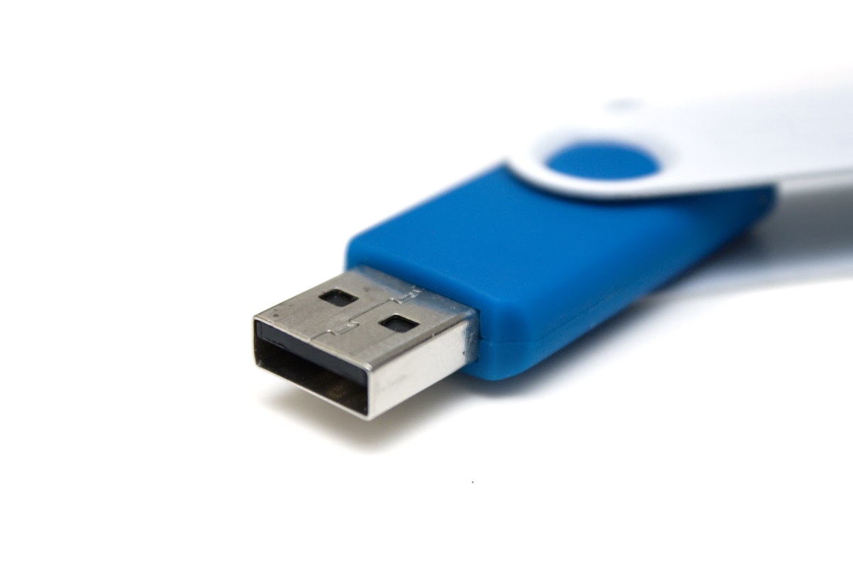 Close up image of a USB memory stick on a white background.