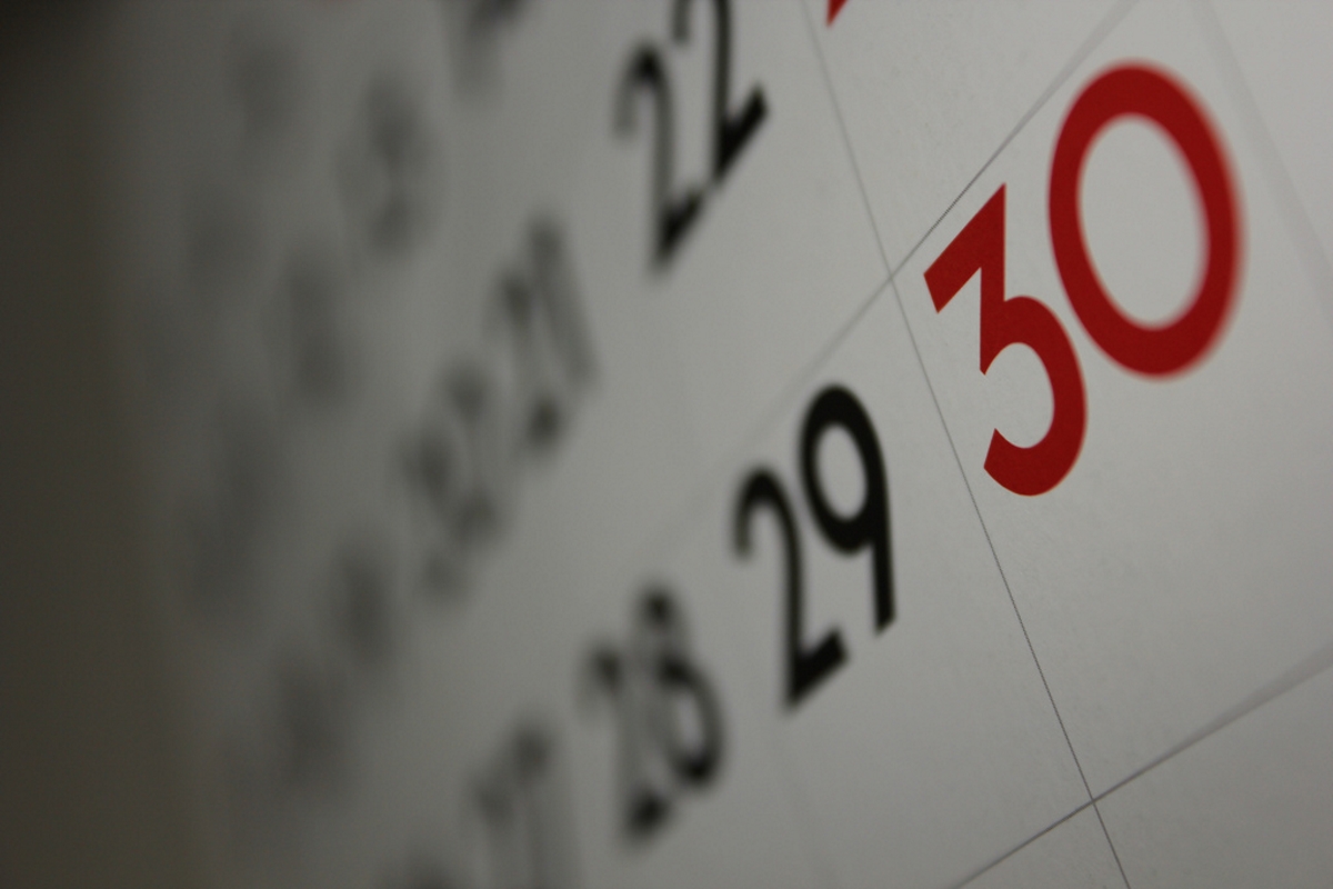 Image: A close-up of a calendar, showing the 30th day marked in red.